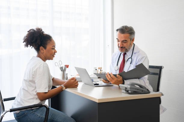 Doctor using stethoscope while examining patient