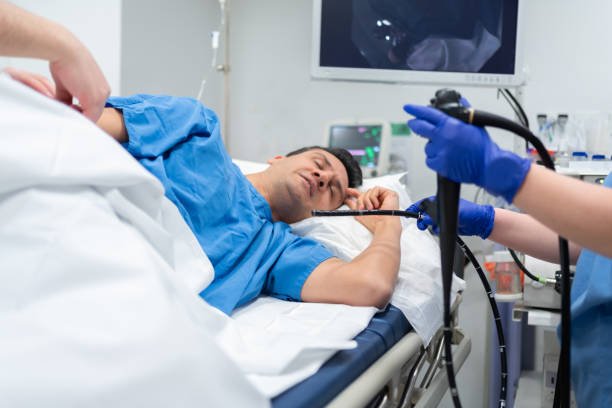 Gastroenterologist Performing Gastroscopy And Colonoscopy At Hospital